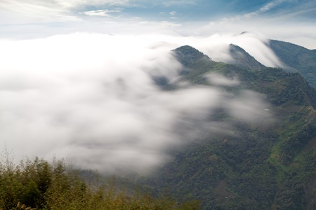 Sunshine with mountain , cloud and fog in the morningの写真素材