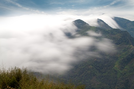 Sunshine with mountain , cloud and fog in the morningの写真素材