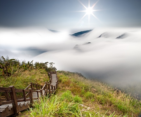 Dramatic clouds with mountain and treeの写真素材