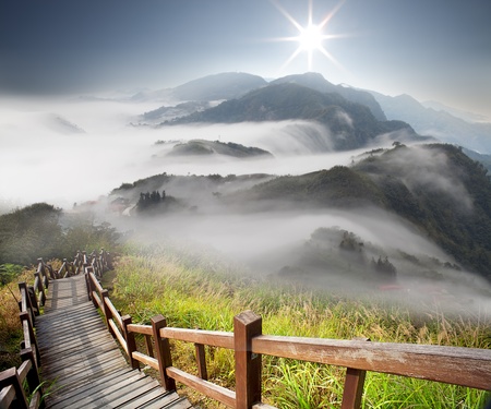 Dramatic clouds with mountain and treeの写真素材