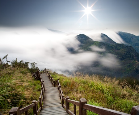 Dramatic clouds with mountain and treeの写真素材