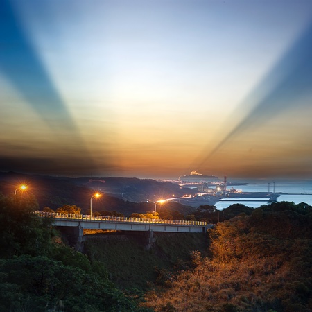 A road and windmills during sunset, made with a wide angle lens の写真素材