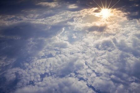 Blue sky with clouds and sun  