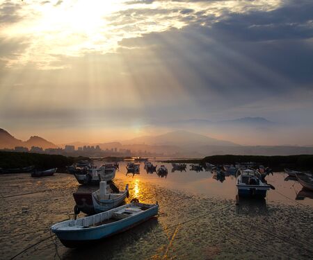 Last sunrise and fishing sub-dug with flash, the new Taipei, Taiwan の写真素材
