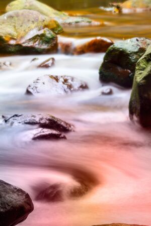 Fast flowing water in the mountain river for adv or others purpose useの写真素材