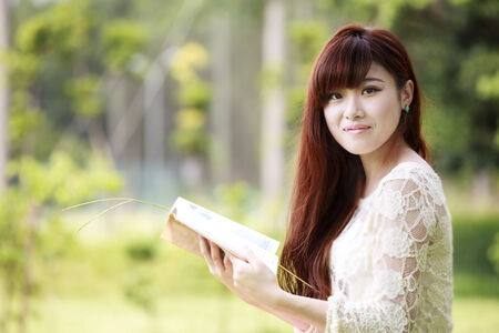 Outdoor summer portrait of young pretty cute girl for adv or others purpose useの写真素材