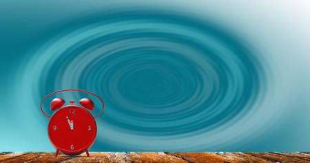 The alarm clock with little minutes to twelve o'clock