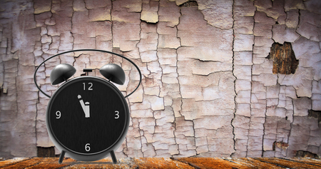 The alarm clock with little minutes to twelve o'clockの写真素材