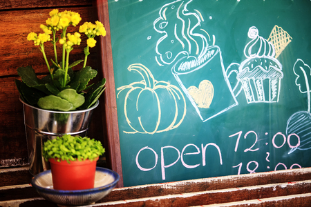 The store open time with nice flower and cute pictureの写真素材