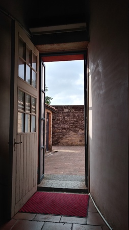 The Opening door it show the bule sky and open spaceの写真素材