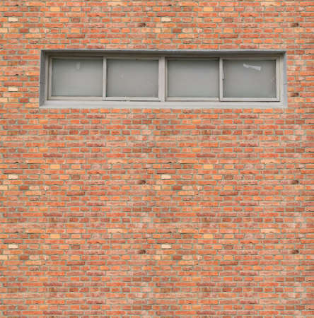 The White window at vintage red brick wallの写真素材