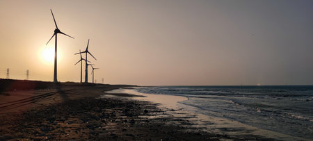 The sunset of wind farm at bali, new taipei city, Taiwanの写真素材