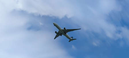 The Airplane in the sky at sunrise or sunsetの写真素材