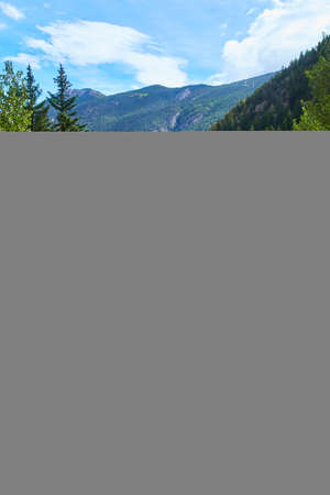 River through mountains in urban areaの写真素材