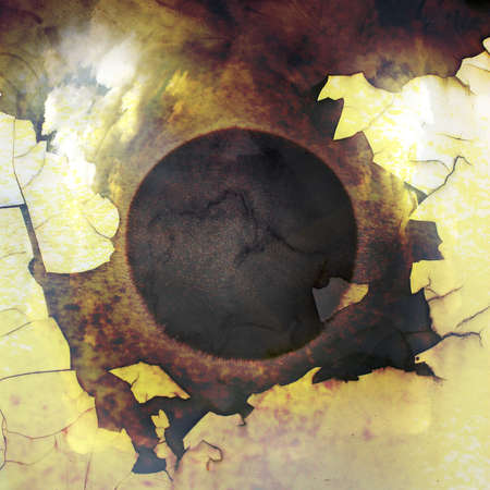 Abstract black cracking circle superimposed on a white painted peeling surfaceの写真素材