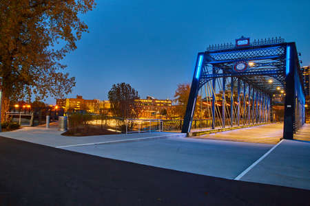 Boardwalk downtown with metal walking bridge at dusk or dawnの写真素材