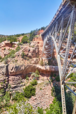 Arizona rocky mountains with large steel bridgeの写真素材