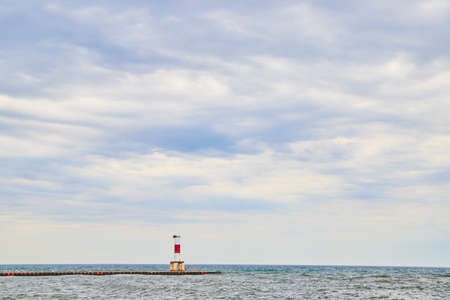 Open sky view with lake and pier at bottomの写真素材