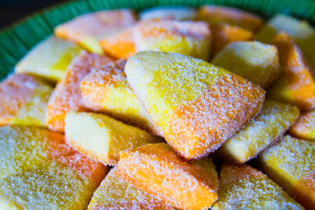 Halloween treat candy corn cookies dusted with powdered sugarの写真素材