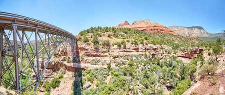 Panorama of steel bridge in mountains of desertの写真素材
