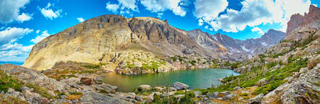 Lake at the top of the mountains and blue skyの写真素材