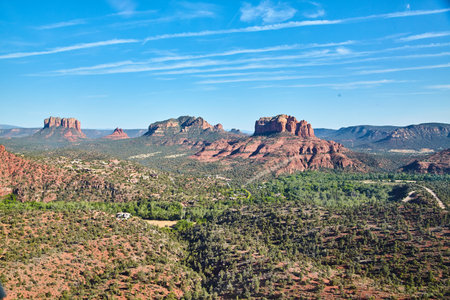 Aerial view of desert mountains red rocks and green fieldsの写真素材