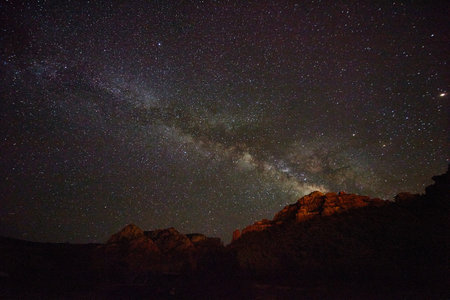 Desert mountains of red with milky way starsの写真素材
