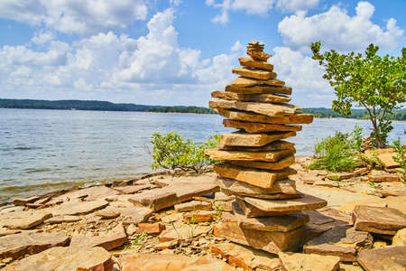 Tall and serene cairn stack of rocks on beachの写真素材