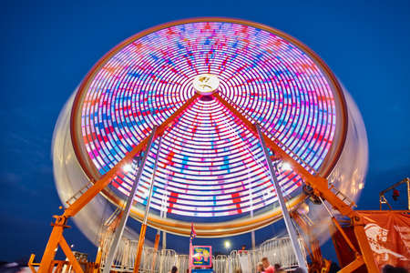 Ferris wheel with red, white, and blueの写真素材