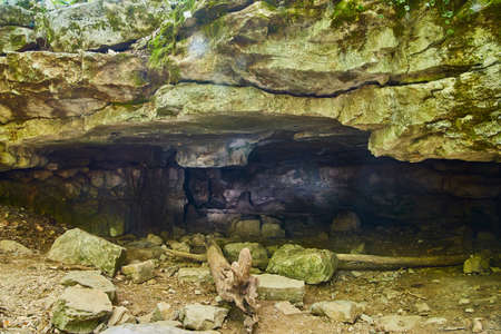 Mossy cave with an eerie lightの写真素材