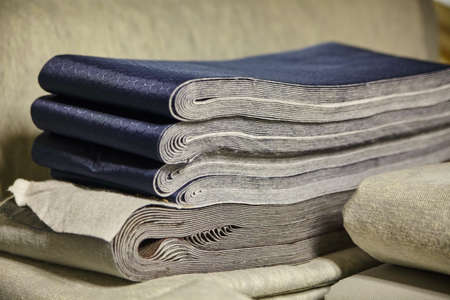 Variety of fabric materials one with a blue honeycomb pattern and a simple gray for the otherの写真素材