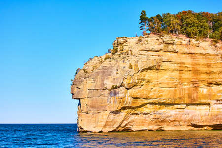 Pictured Rocks with blue and slightly choppy waters of the lakeの写真素材