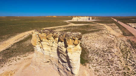 Pillars of white rock in middle of flat desertの写真素材