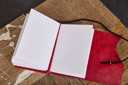 Pages blank of open journal sketchbook with red leatherの写真素材