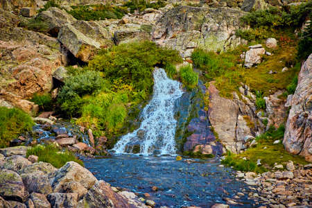 Large waterfall with lichen bouldersの写真素材