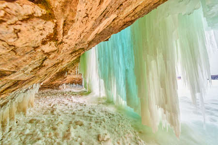 Frozen waterfall from inside ice cavernの写真素材