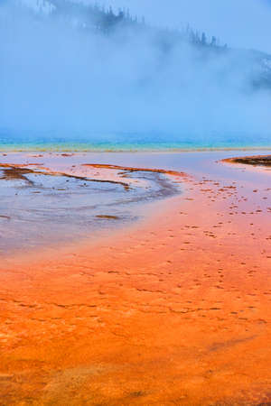 Steam covers iconic Grand Prismatic Spring in Yellowstone winterの写真素材