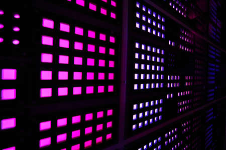Angle of wall covered in purple square lightsの写真素材