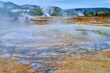 Yellowstone in winter with thermal pools of alkaline watersの写真素材