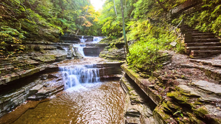 Aerial over gorge with stone staircase path and waterfallsの写真素材