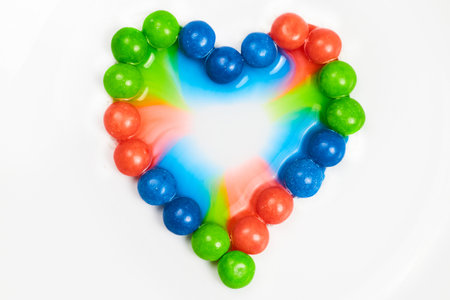 Blue and green and pink skittle heart backgroundの写真素材