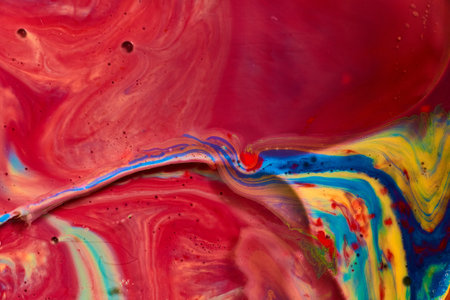 Abstract silk scarf with vibrant colors swirling in sea of red background assetの写真素材