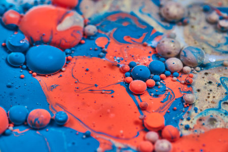 Bubbles marbles and spheres in abstract acrylic pour with paint and milk creating a swirl of shiny colors in background assetの写真素材