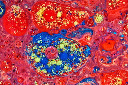 Abstract island of blue yellow and red bubbles in acrylic painting with a sea of red stars in cosmos...