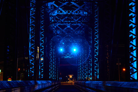 Walking bridge at night old truss railroad bridge with neon blue lights Mount Vernon Ohio