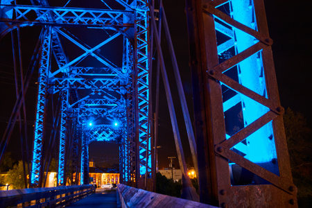 Close up of interior glowing neon blue truss bridge beam at night Mount Vernon Ohioの写真素材