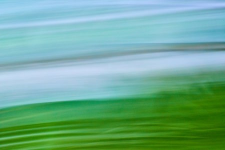 Abstract background asset art gentle rolling green fading into peaceful blueの写真素材