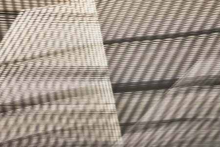 Grayscale abstract art with odd shapes and woven fabric like materialの写真素材