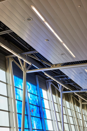 Blue art tiles on windows leading to white sky and ceiling viewの写真素材