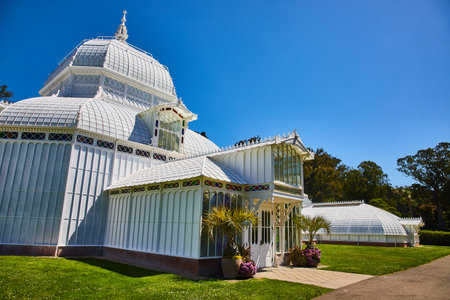 Exterior of Conservatory of Flowers building with bright sunny day and clear blue skiesの写真素材